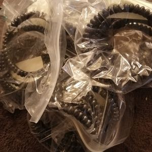 24 black plastic bangles